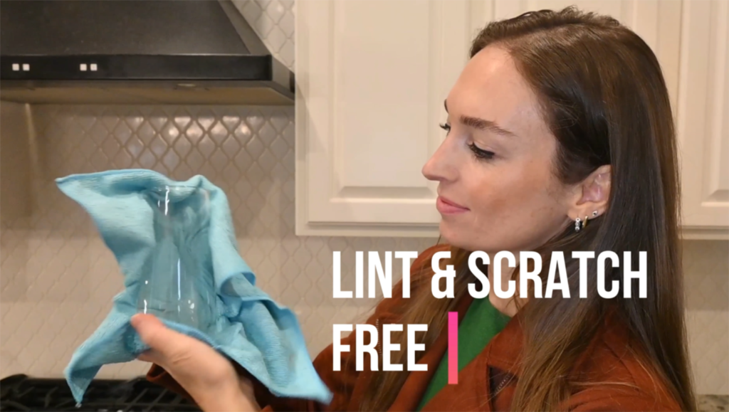 a model picture displaying lint and scratch free microfiber cleaning cloth.